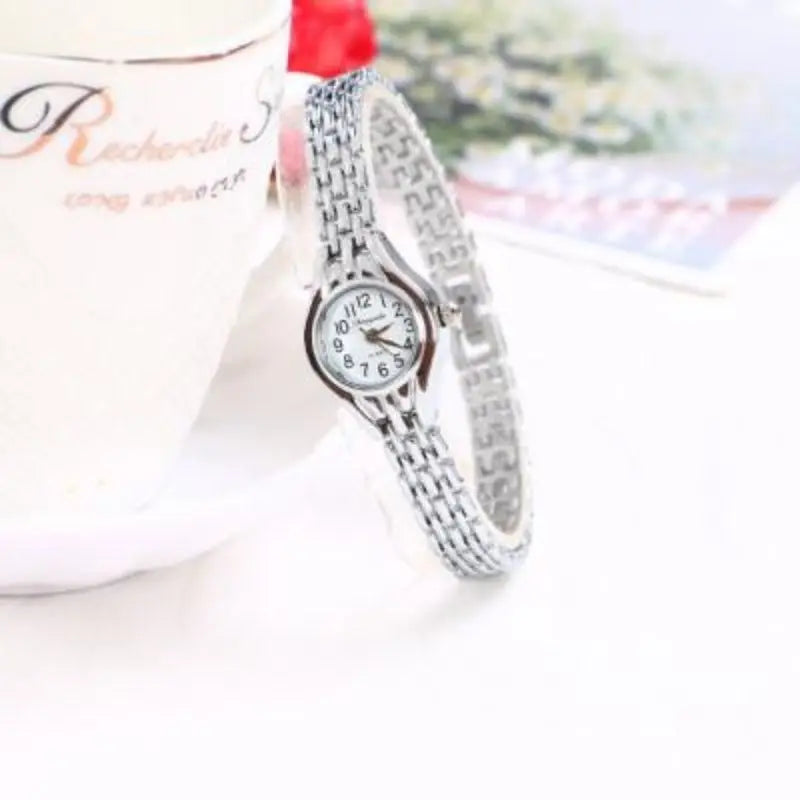 Golden Luxury Women's Bracelet Watch with Elegant Small Dial Quartz Design