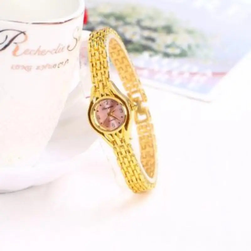 Golden Luxury Women's Bracelet Watch with Elegant Small Dial Quartz Design